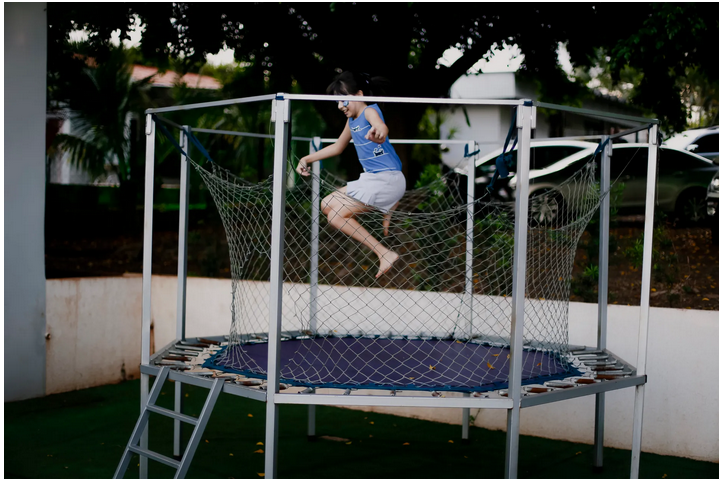 jumping on a trampoline